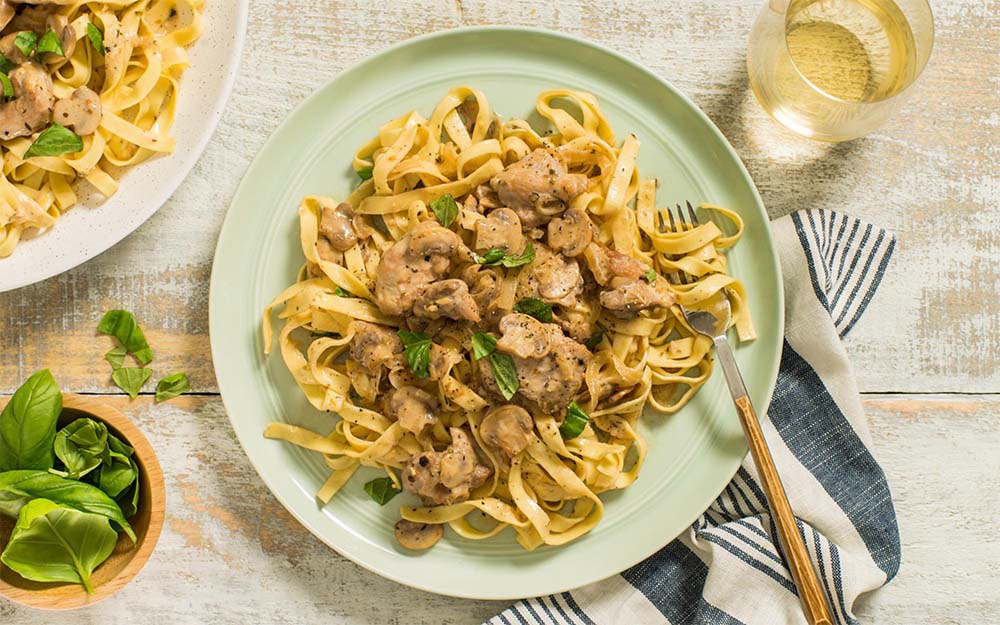 Chicken Fettuccine alla Boscaiola with a creamy mushrooms sauce and fresh pasta,